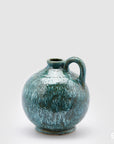 Vaso River, monofiore con manico, turchese, misura H. 25xD 22cm. EDG