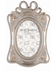 Portafoto piccolo con fiocco e ornamenti barocchi. Blanc Mariclò