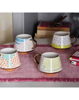 Mug con disegni giallo e oro. Tognana