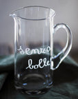 Brocca in vetro decoro "Senza bolle" 1,2lt., trasparente con scritta in bianco. Simple day
