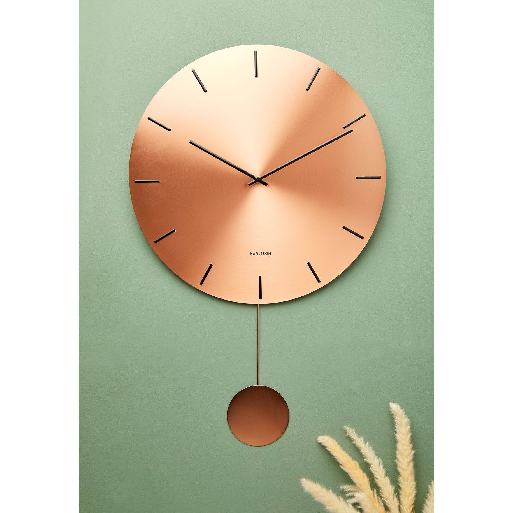 Orologio da Muro "IMPRESSIVE PENDULUM" colore rame. KARLSSON