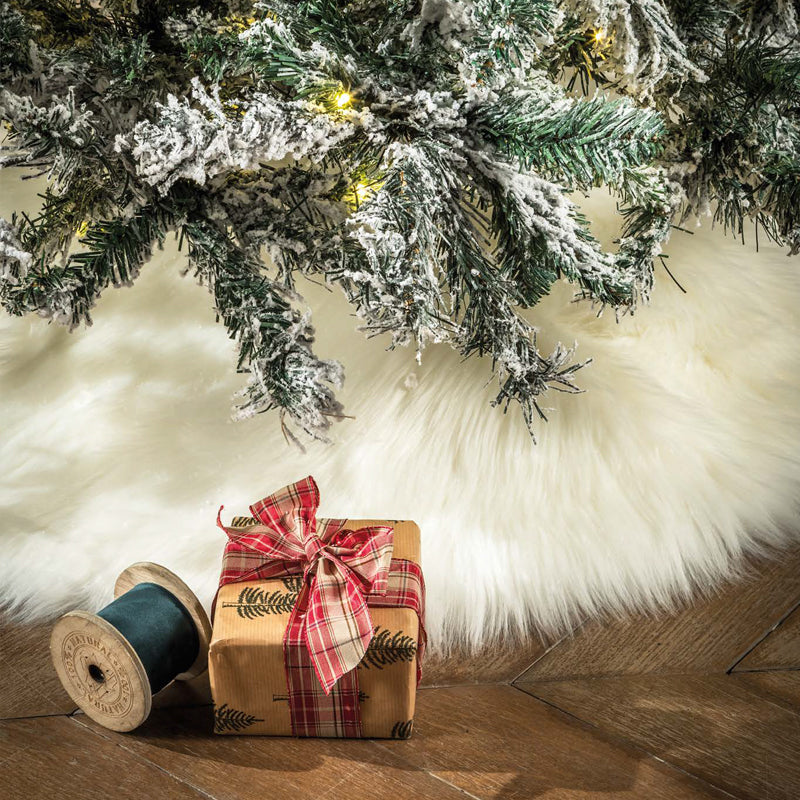 Copribase per albero di natale di colore bianco, in finta pelliccia. L'oca nera