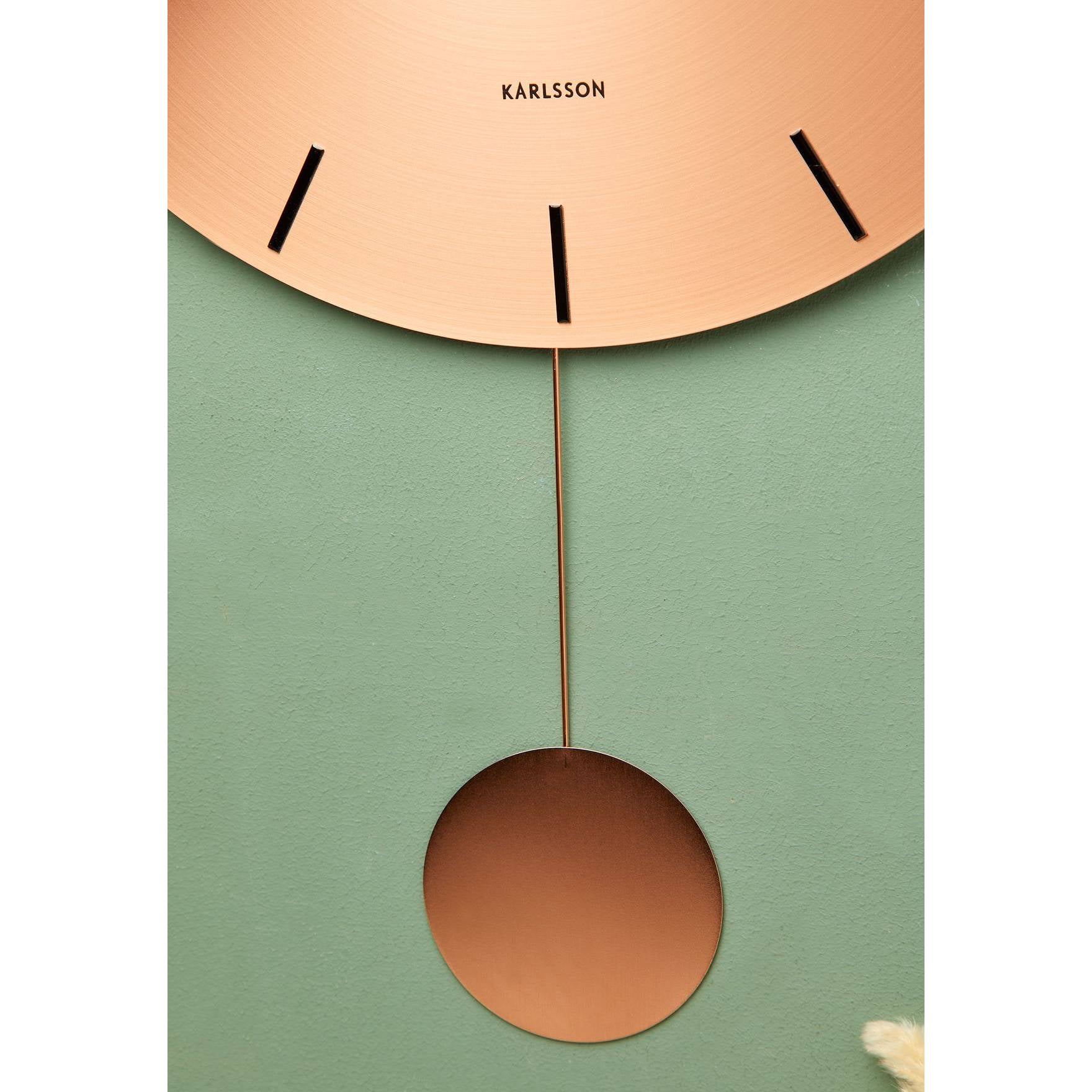Orologio da Muro "IMPRESSIVE PENDULUM" colore rame. KARLSSON