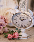 Orologio da tavolo, in peltro, colore bianco anticato. Blanc Mariclò