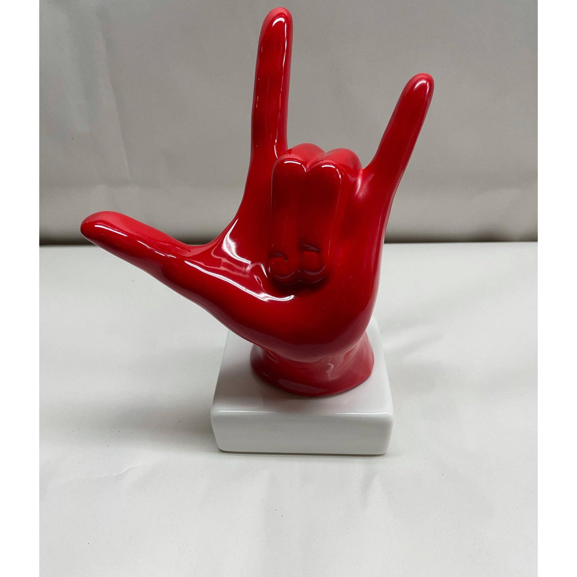 Statua mano "Tiamo rock" colore rosso, in porcellana lucida. Amage